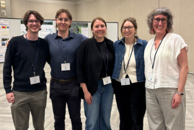 Staff members posed at a science conference.