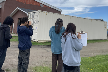 Students participate in bird monitoring.